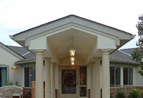 Exterior view of Willow Brook Christian Home entrance with pillars and covered porch