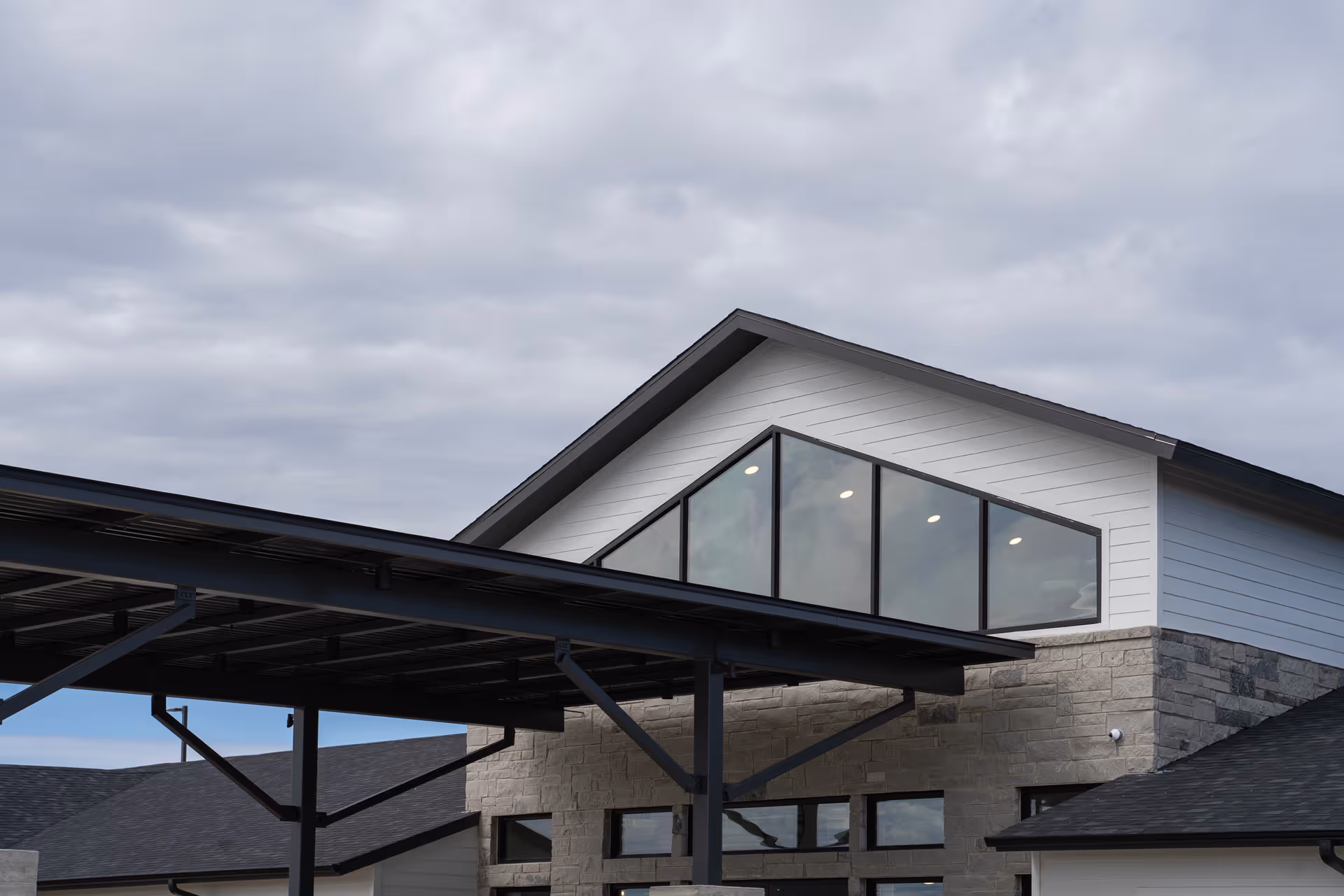 Modern Haven at San Gabriel exterior with sloped roof and large glass front windows.
