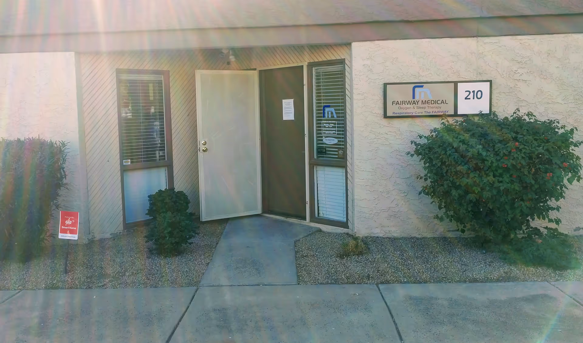 Exterior view of Fairway Medical entrance with sign and shrubbery.