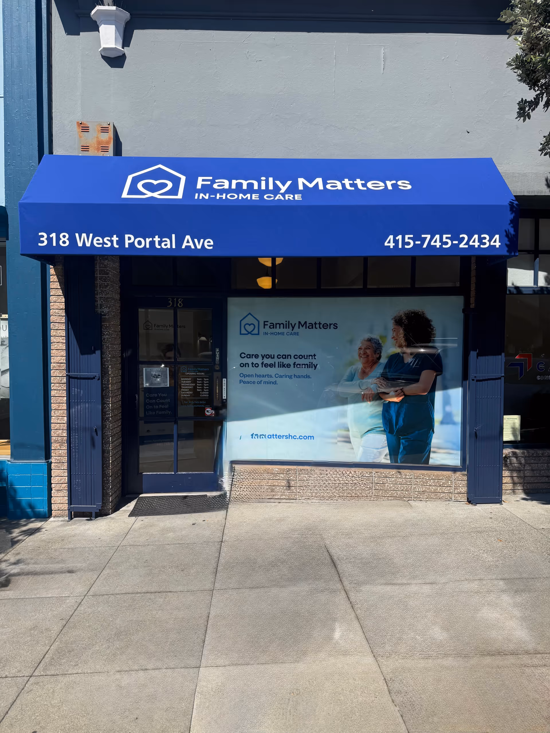 Blue storefront awning reads Family Matters In-Home Care above entrance with window sign.