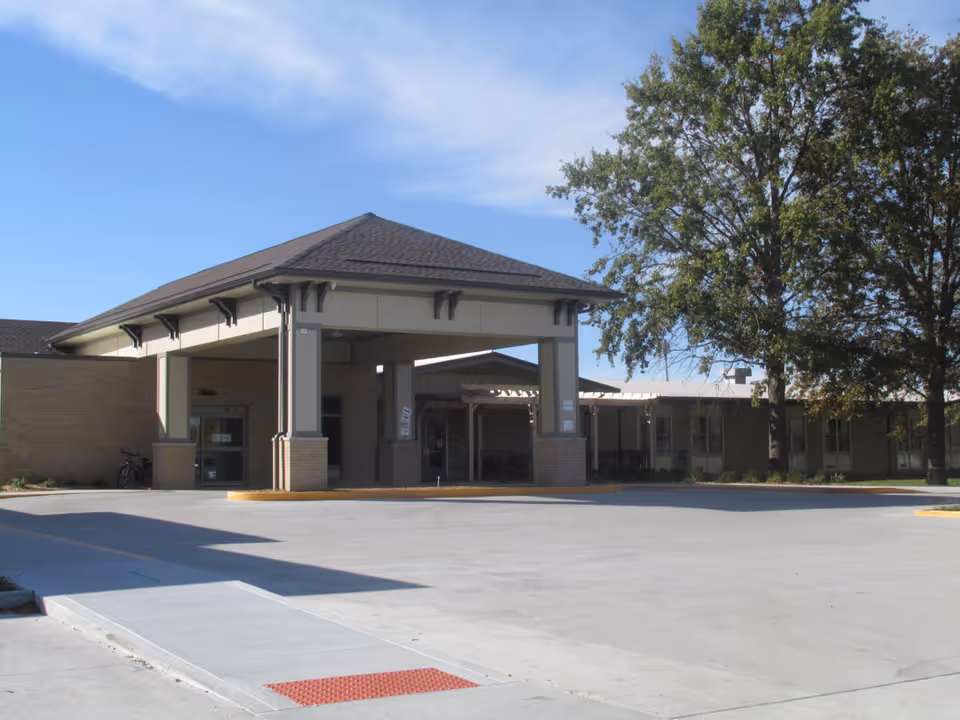 Exterior view of Lutheran Good Shepherd Home entrance with covered drop-off.