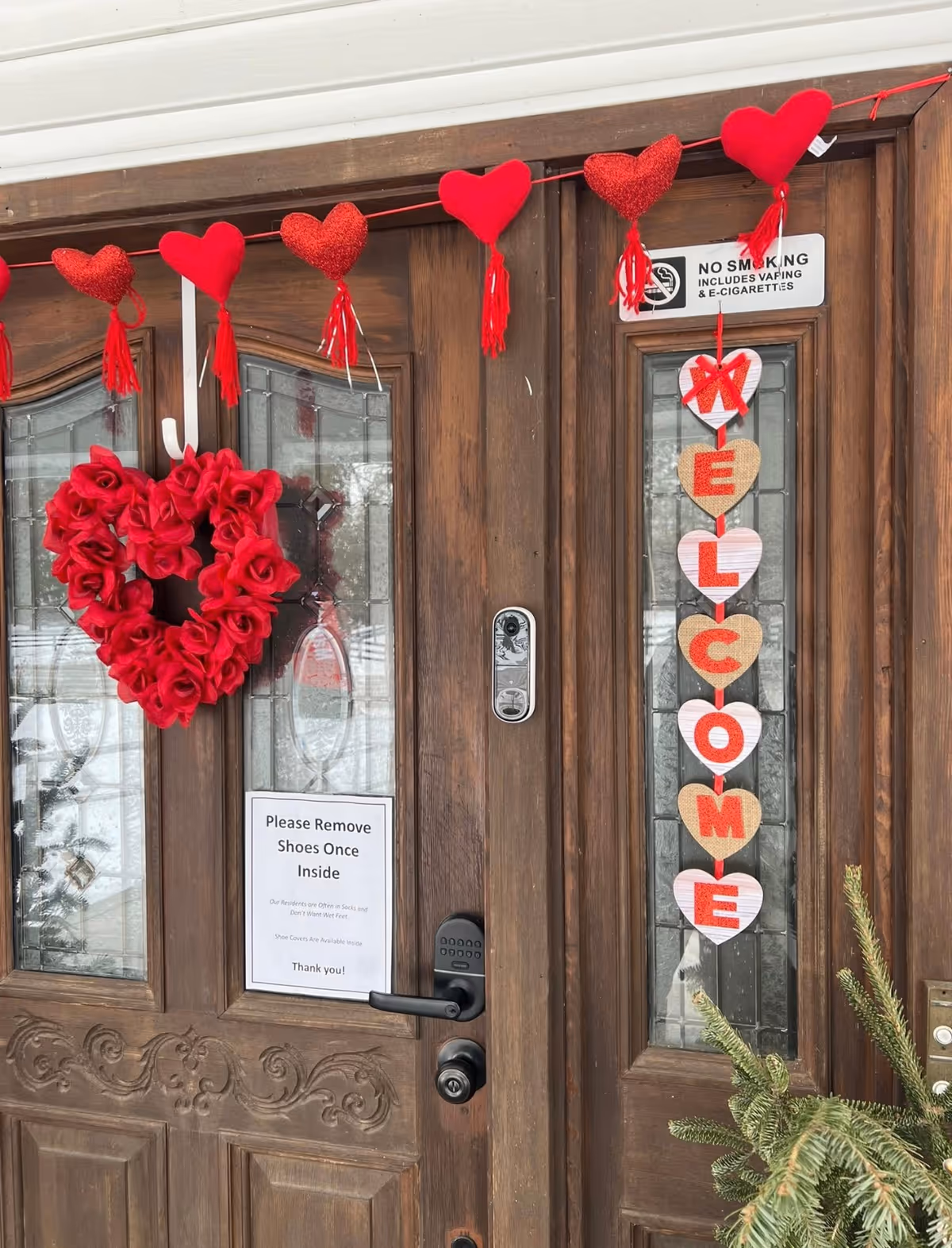 Valentine's decorations decorate a wooden front door of Archer Senior Living Maple Manor Hamburg.