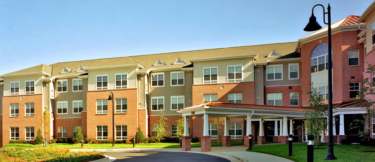 Exterior view of Victory House of Palmer Park, a multi-story senior living building.