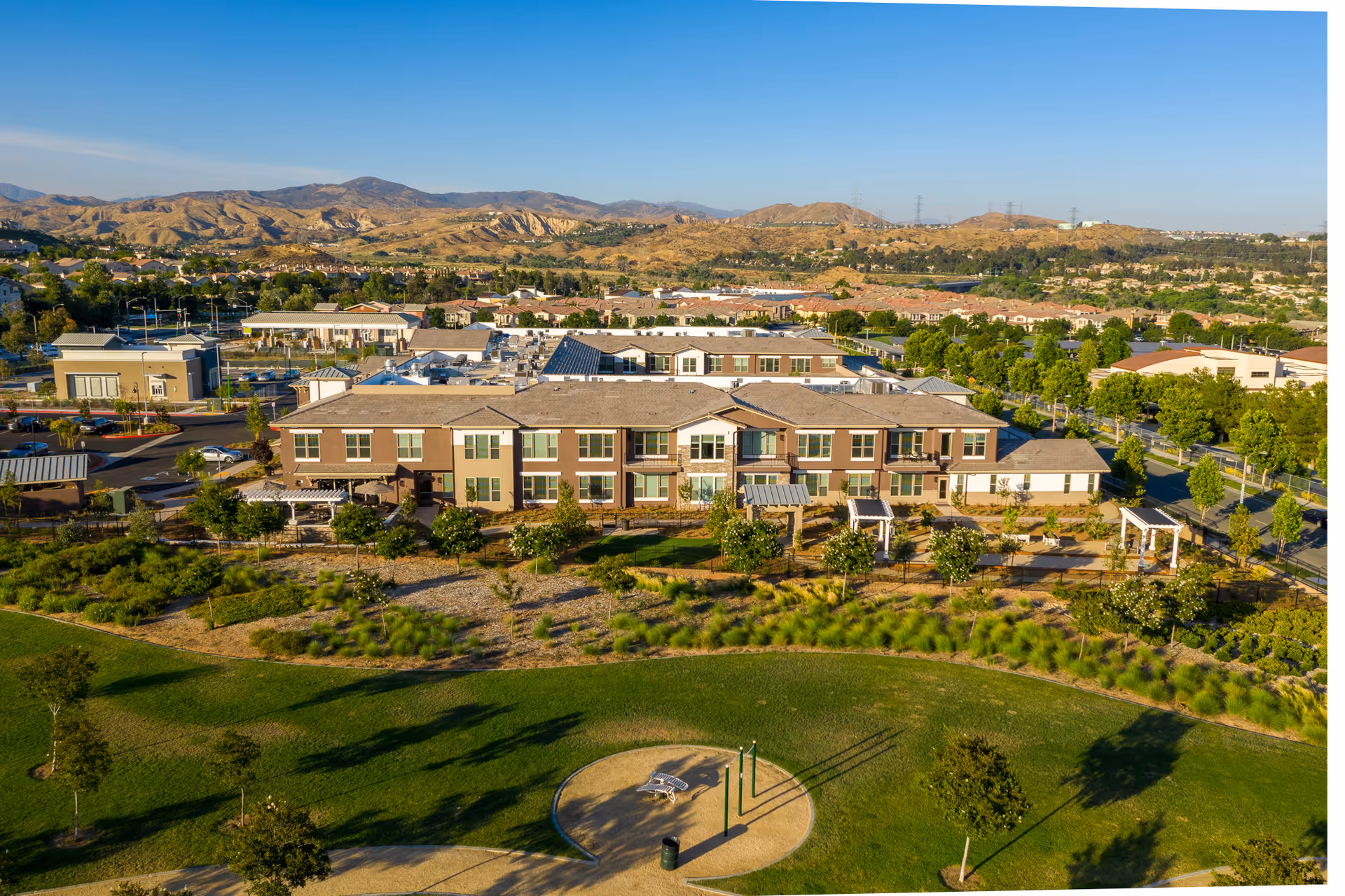 Aerial view of Oakmont of Valencia senior living campus with surrounding hills.