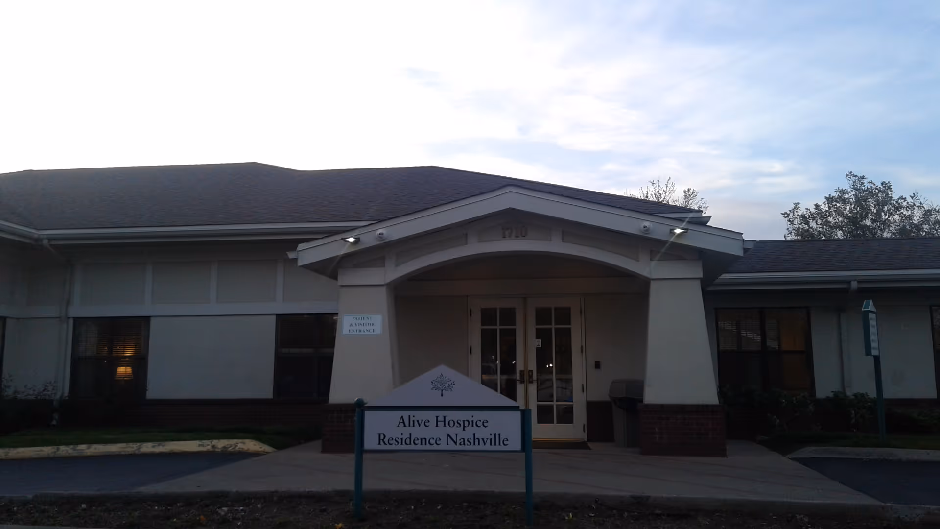 Front view of Alive Hospice Residence Nashville entrance with a sign.