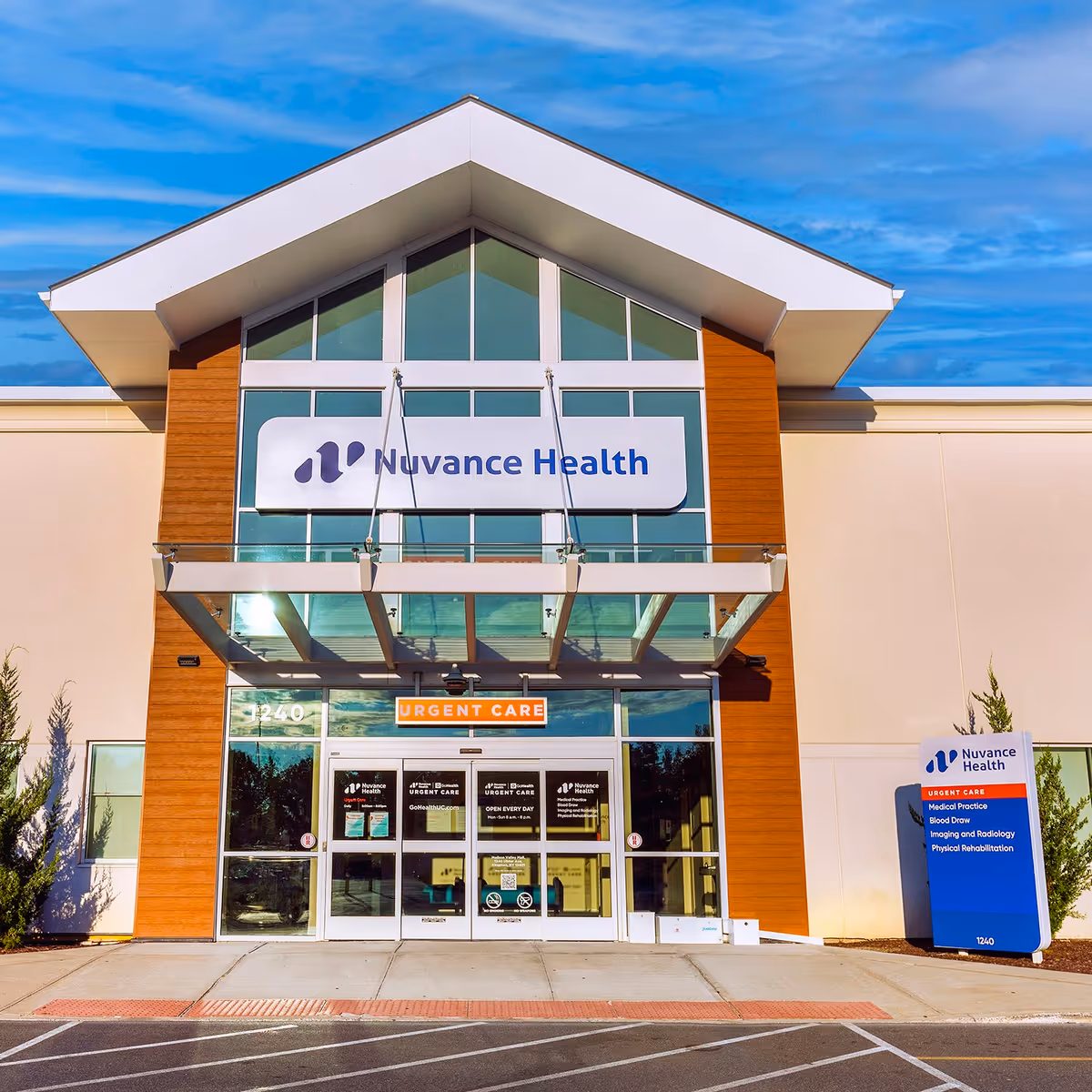Modern medical facility storefront with Nuvance Health sign and glass entrance.