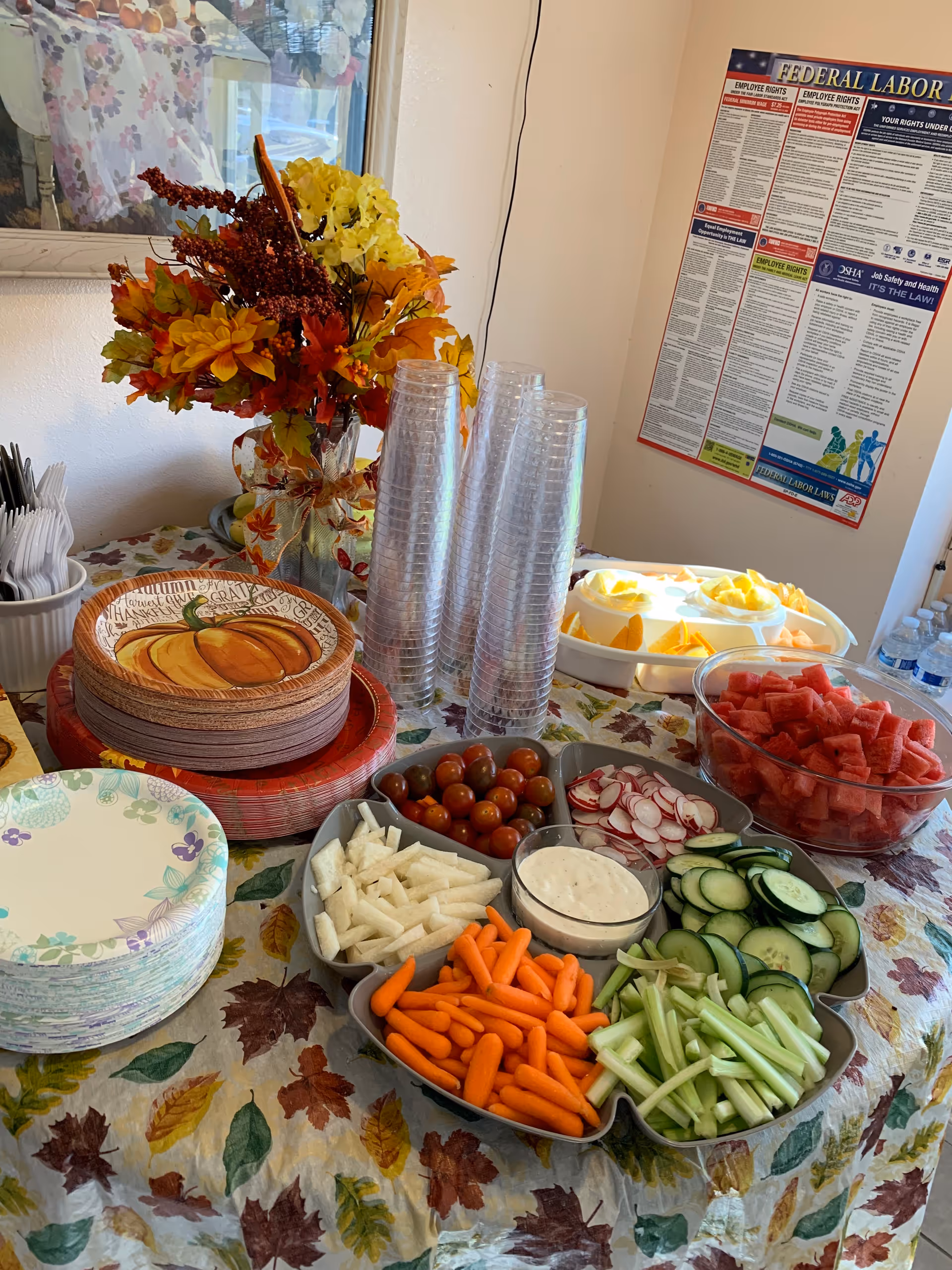 Indoor snack table at Carnelian Villas with fall decor and fresh vegetables.