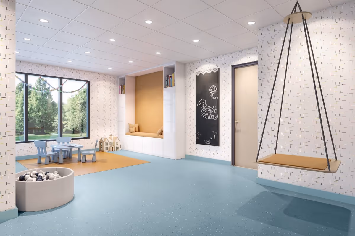 Bright indoor playroom with a hanging swing, small blue table set, and window view.