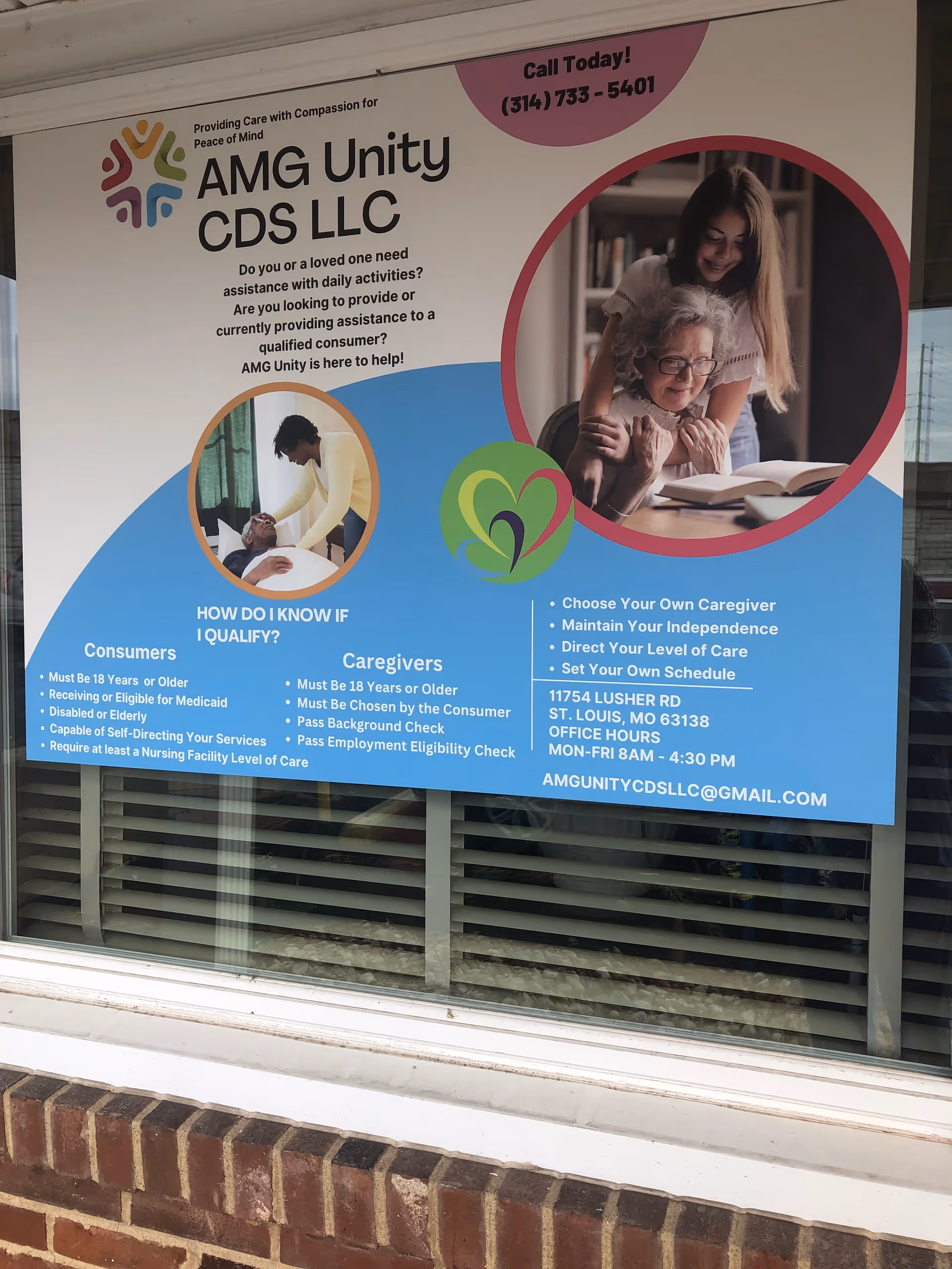 Front window sign advertising AMG Unity CDS LLC with caregiver and elderly images.