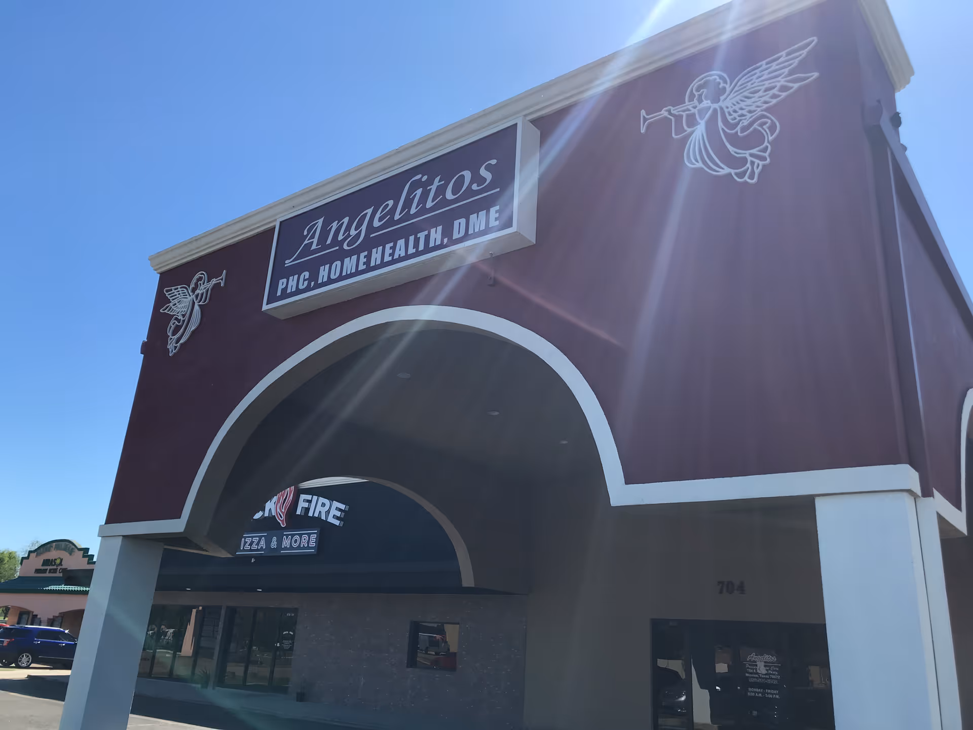 Front facade of Angelitos Primary Home Care building with maroon exterior and angel logo.