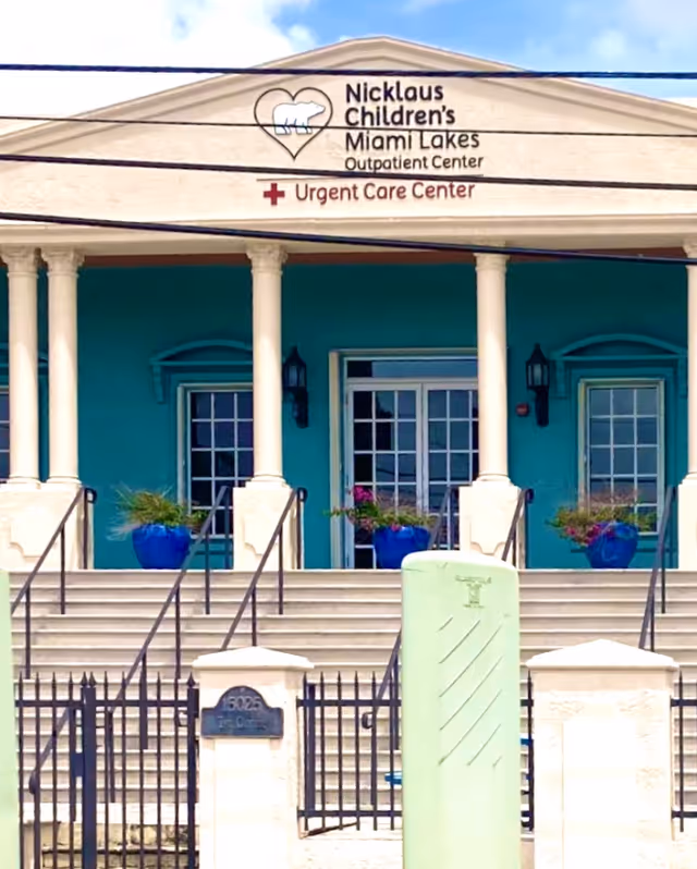 Front facade of Nicklaus Children's Miami Lakes Outpatient Center with steps and columns.