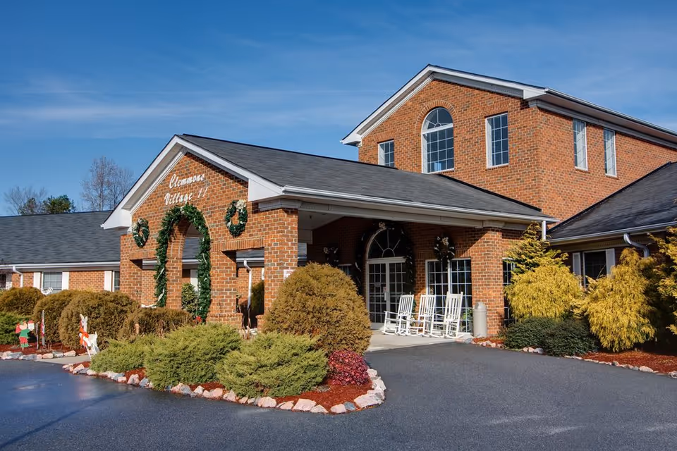 Exterior view of Clemmons Village II Assisted Living with entrance and landscaping