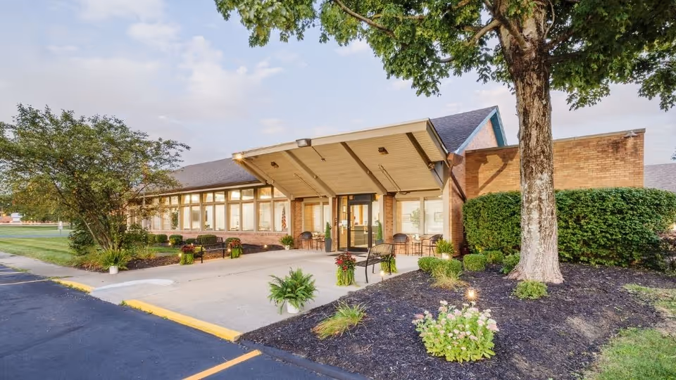 Exterior view of Buckeye Care and Rehabilitation entrance with a covered walkway and landscaping