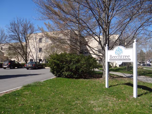 Beechtree Center for Rehabilitation and Nursing building exterior with a sign and parking lot.