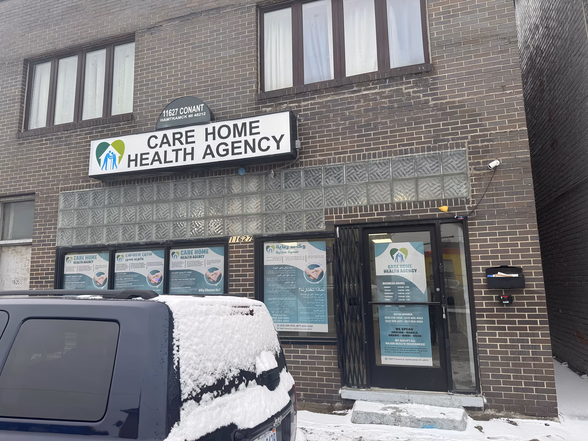 Exterior view of CARE HOME HEALTH AGENCY building with signage and snow.