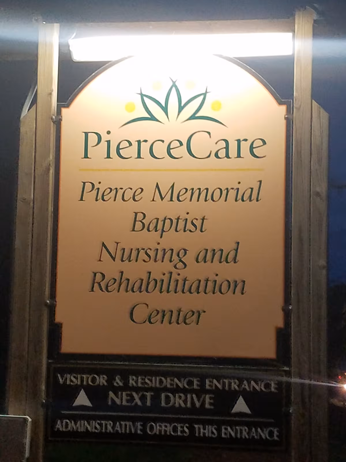 Night exterior sign for PierceCare Nursing and Rehabilitation Center at the building entrance