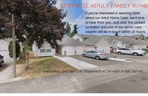 Exterior view of Kent Hill Adult Family Home with garages, cars, and trees.