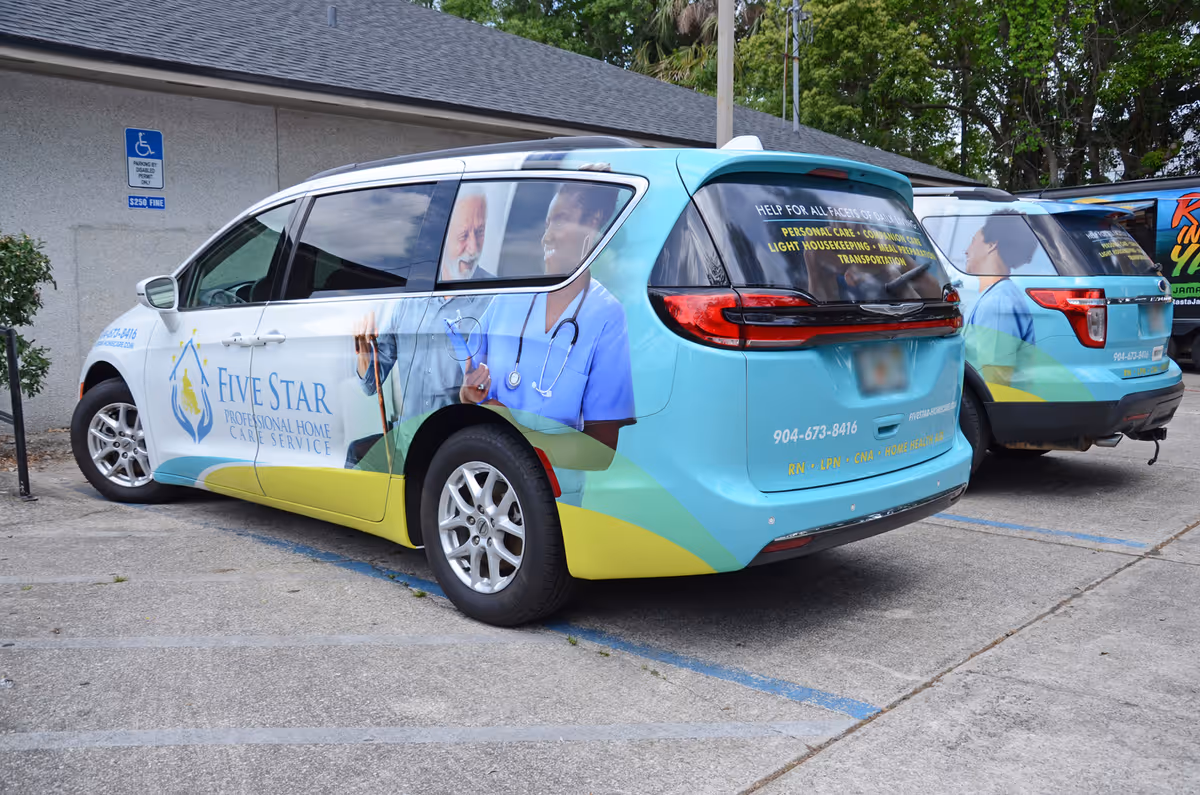 Colorful Five Star professional home care vans parked outside facility with branding