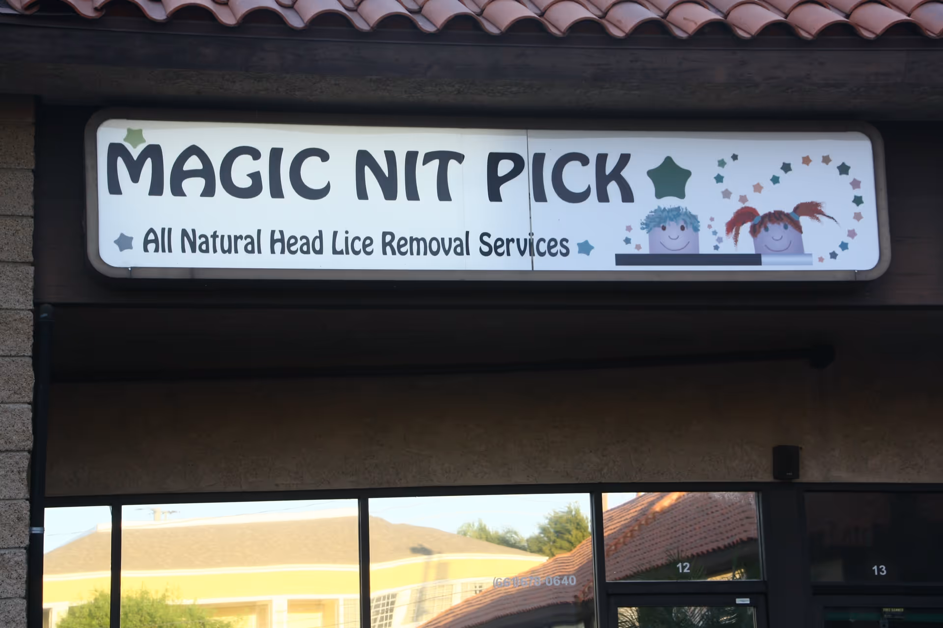Exterior storefront sign reads Magic Nit Pick All Natural Head Lice Removal Services.