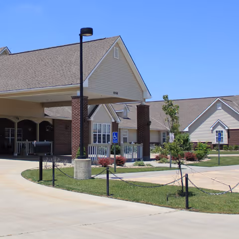Front view of Vintage Park at Ottawa facility with entrance, lamppost, and landscaped walkway.