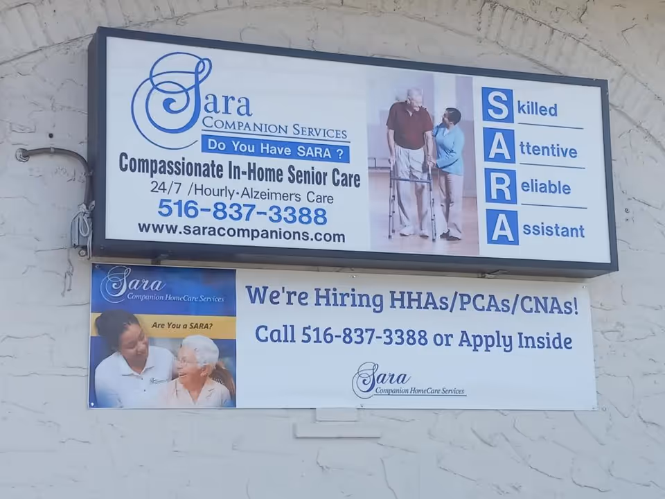 Exterior wall with Sara Companion HomeCare Services signage and banners.
