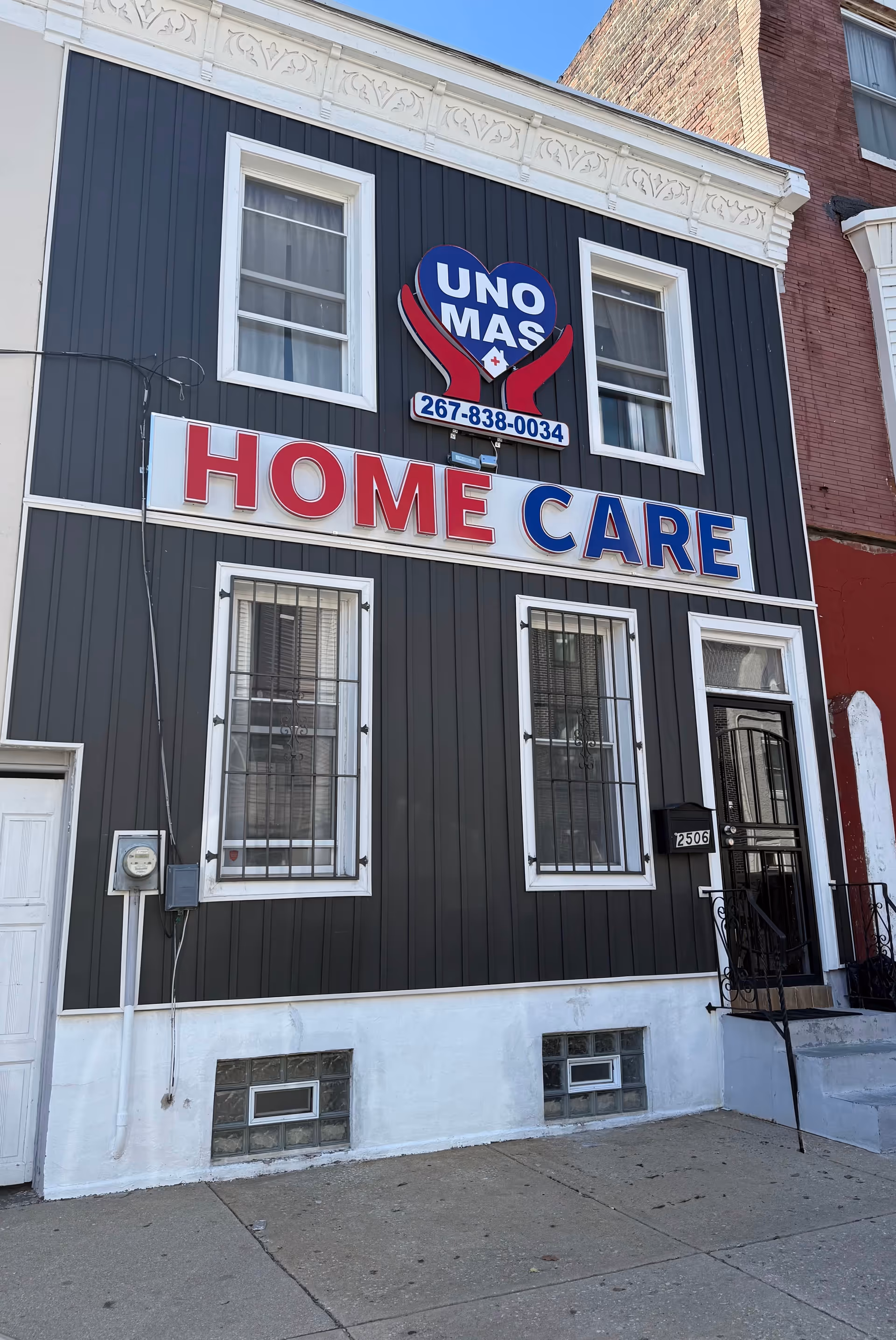 Facade of a two-story building with UNO MAS Home Care sign and bold HOME CARE.