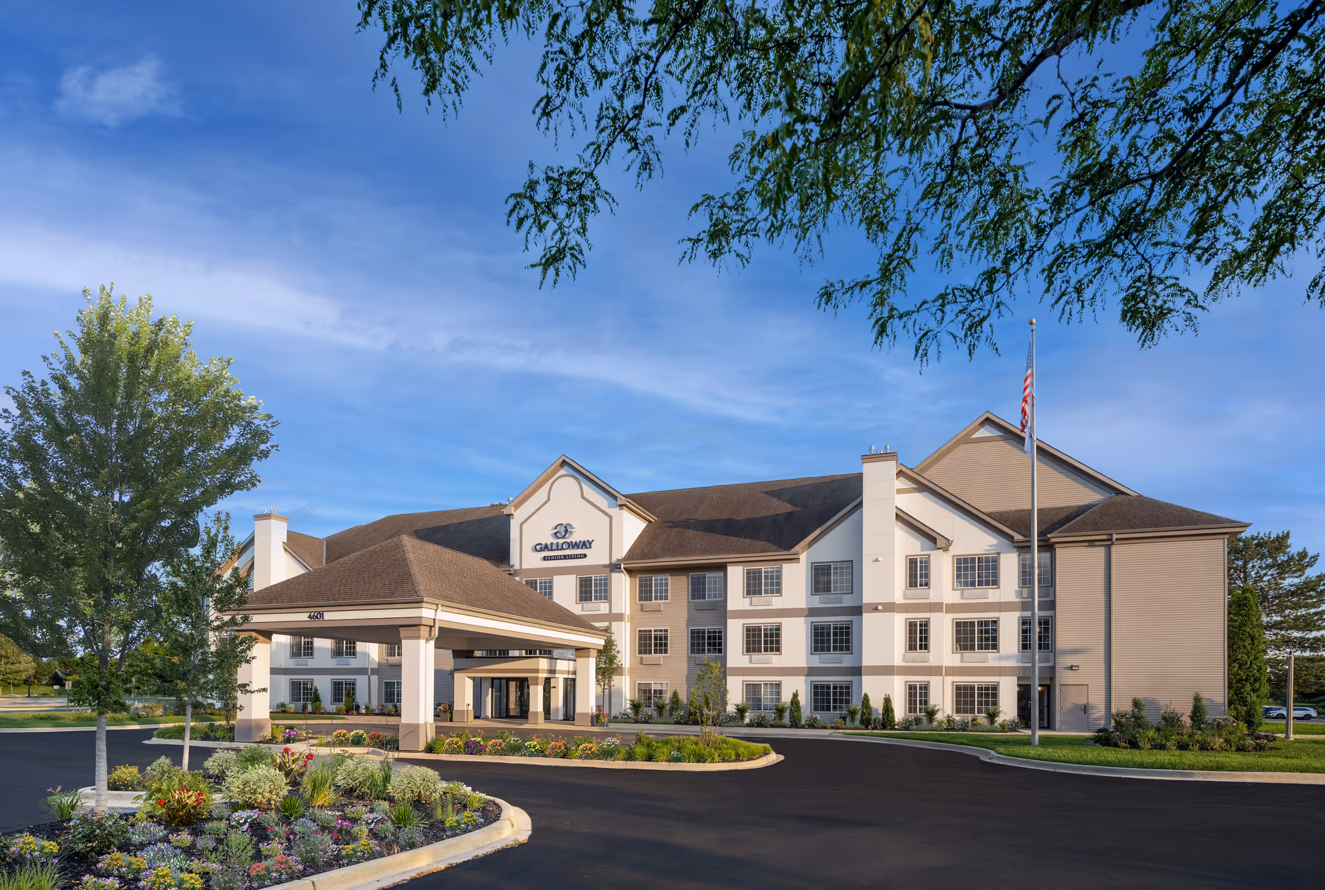 Front exterior view of Galloway Senior Living building with entrance and landscaped grounds.