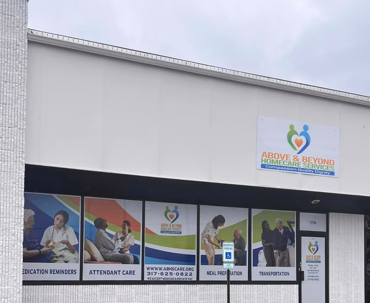 Exterior view of Above and Beyond Homecare Services building with a large sign.