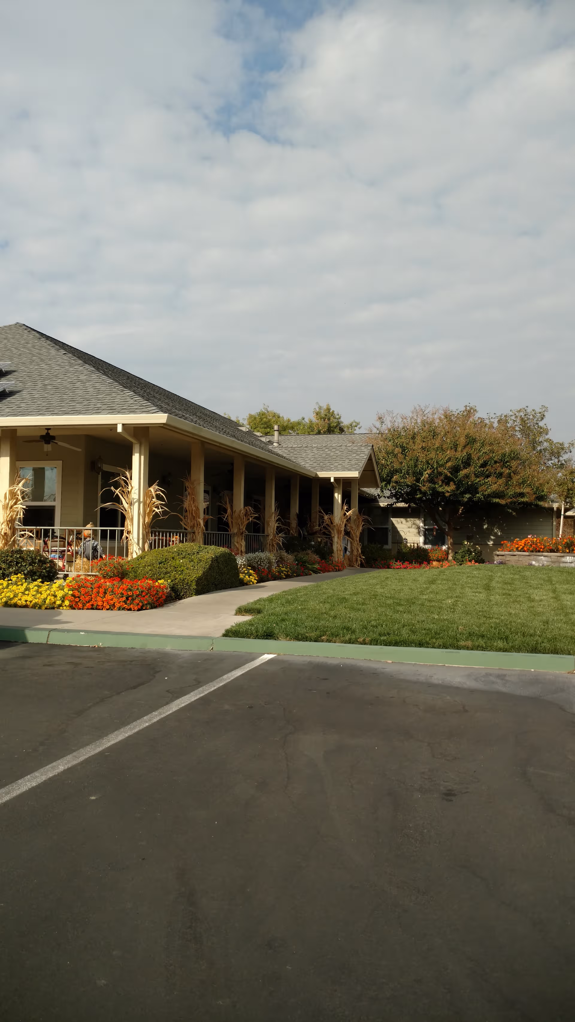 Exterior view of Westhaven Assisted Living with a covered entrance and landscaped front lawn.