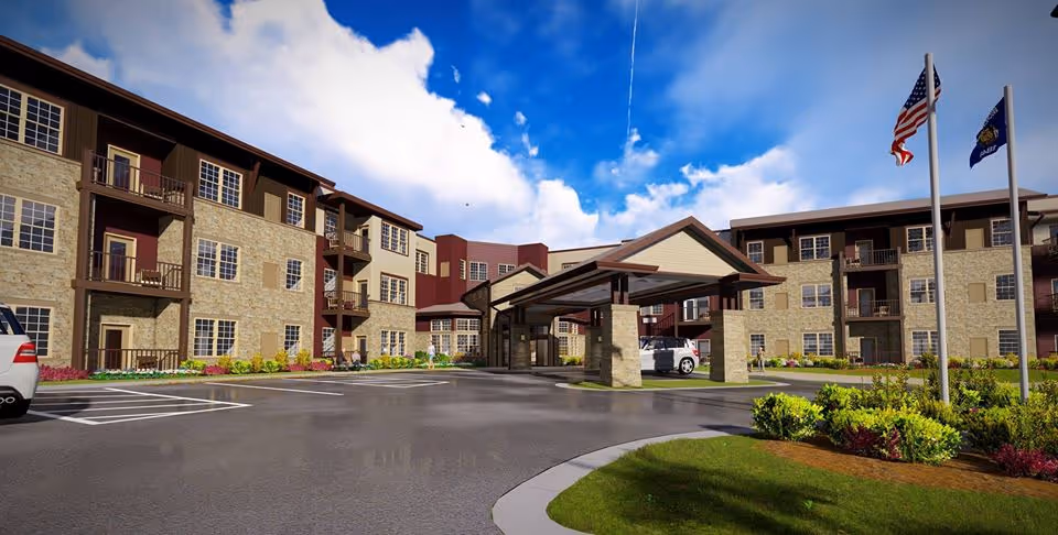 Exterior view of Lifespark Senior Living with a covered entrance, parking lot, and flags.