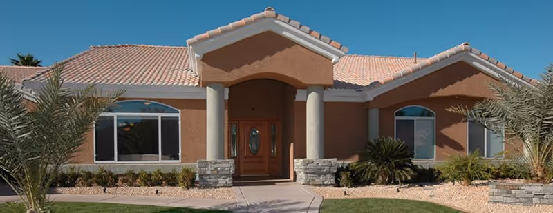 Front view of Primrose Retirement Community Jefferson City, a single-story facility with stone entry.
