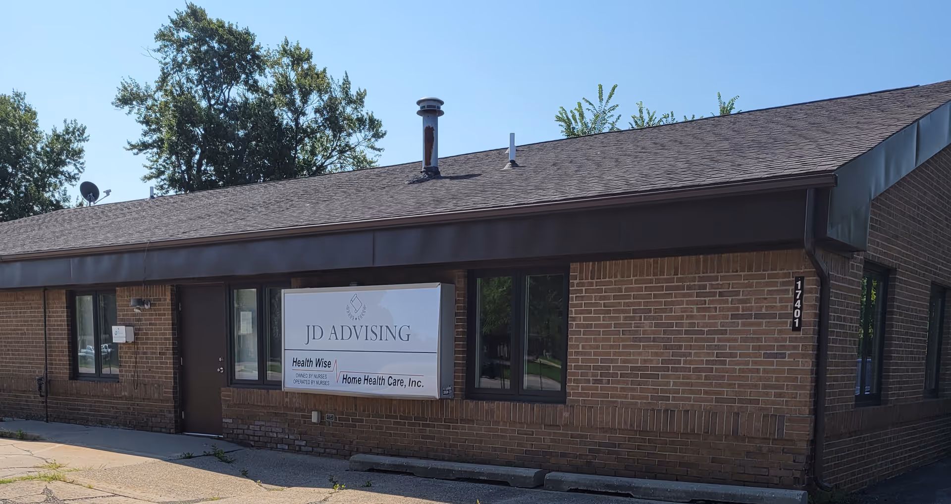 Brick, single-story building exterior with Health Wise Home Health Care, Inc. sign.