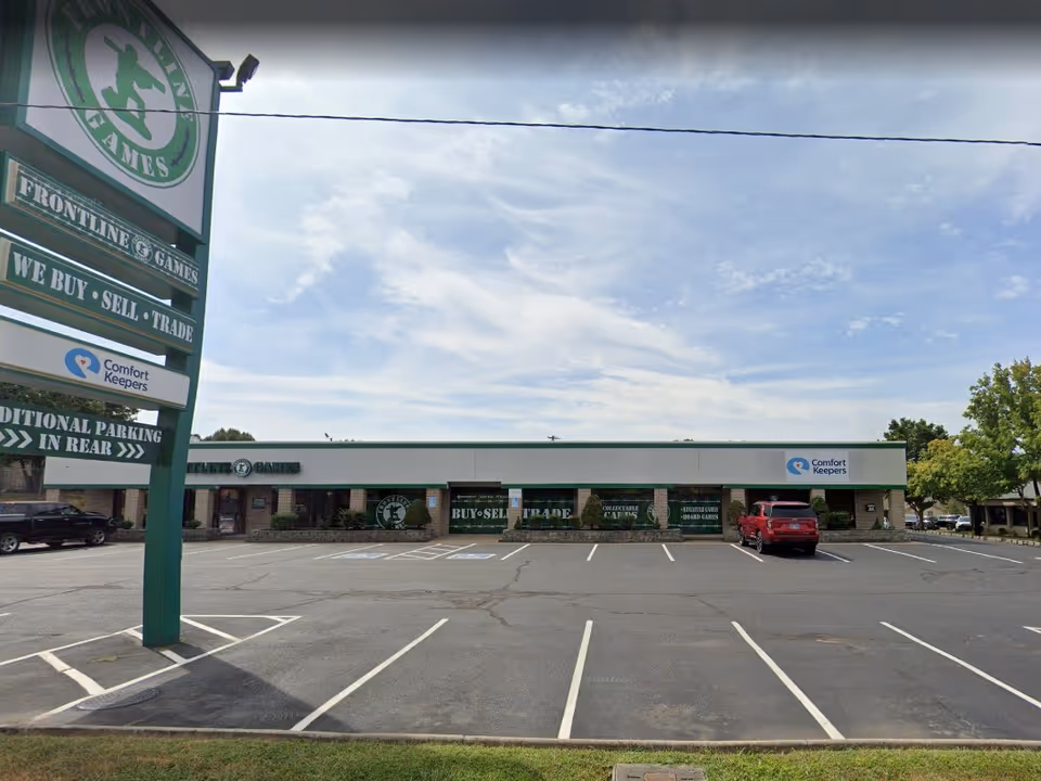 Exterior view of Comfort Keepers facility in Clarksville, TN, with a large parking lot.