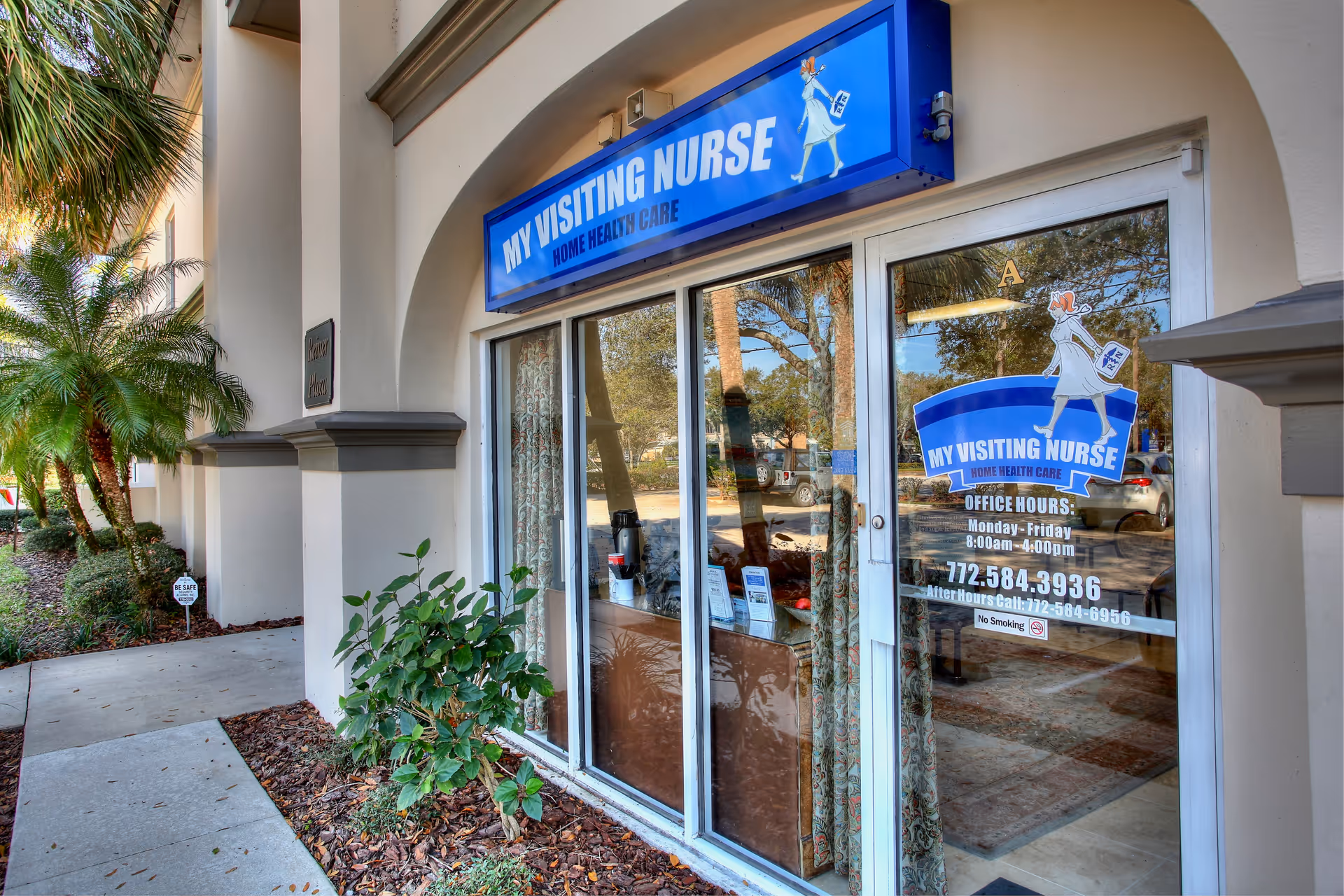 Blue My Visiting Nurse sign above glass doors at the building entrance.