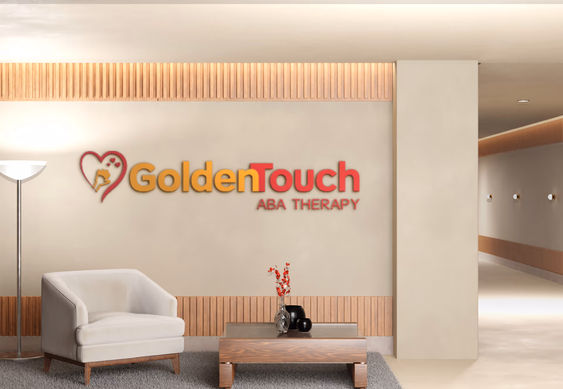 Lobby area with Golden Touch ABA Therapy logo and modern seating.