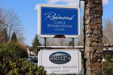 Outdoor entrance signs for Redmond Care and Rehabilitation Center and Redmond Heights Senior Living.