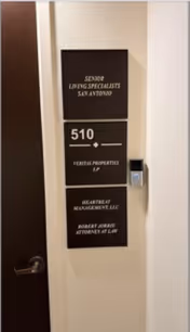 Interior hallway wall with sign panels for Senior Living Specialists San Antonio and unit 510