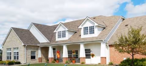 Exterior view of Brookdale Barberton senior living building with a front entrance and columns.
