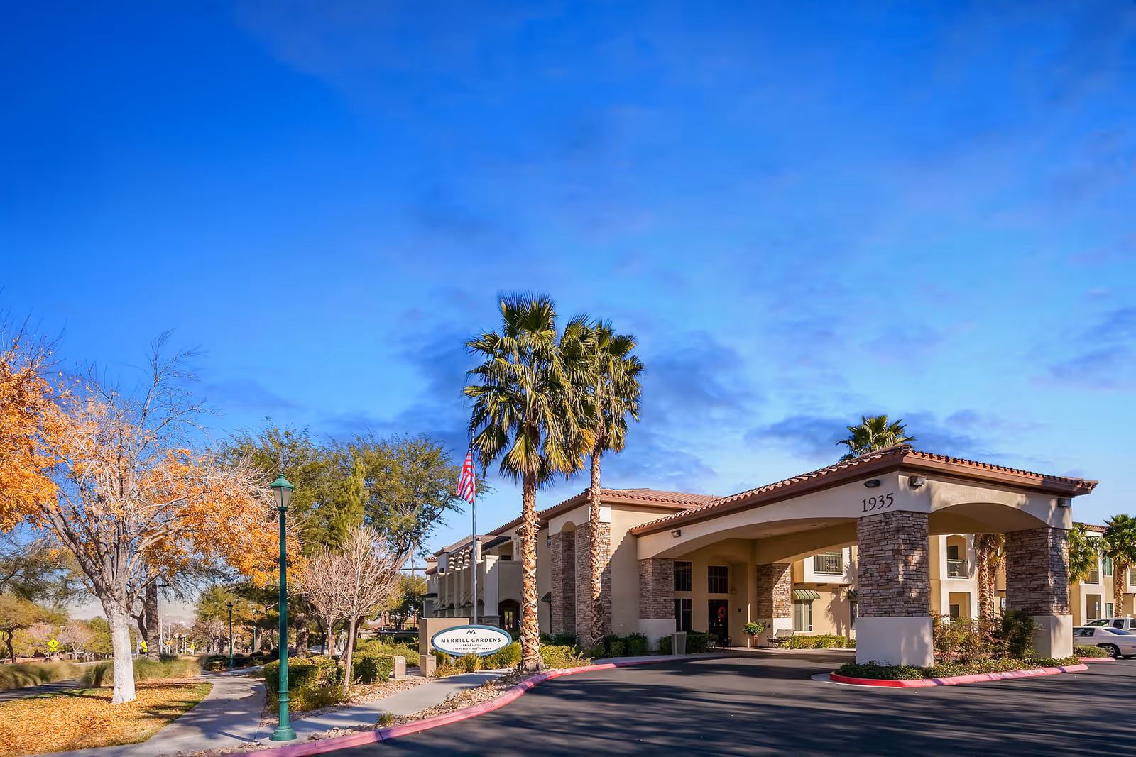 Merrill Gardens at Green Valley Ranch exterior entrance with palm trees