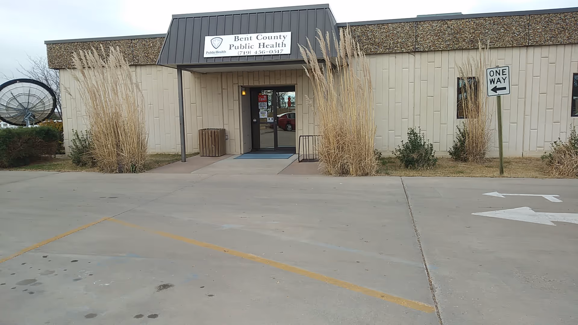 Front view of Bent County Public Health building with entrance and parking lot
