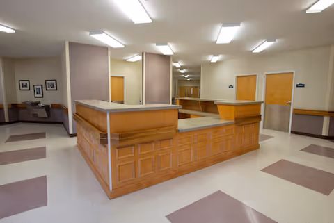 Spacious reception desk area in a hallway of Autumn Care of Biscoe.