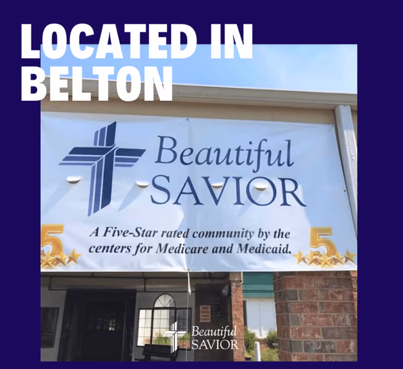 Banner on a building exterior displaying the name Beautiful Savior with a cross logo and text stating it is a five-star rated community by the centers for Medicare and Medicaid, located in Belton.
