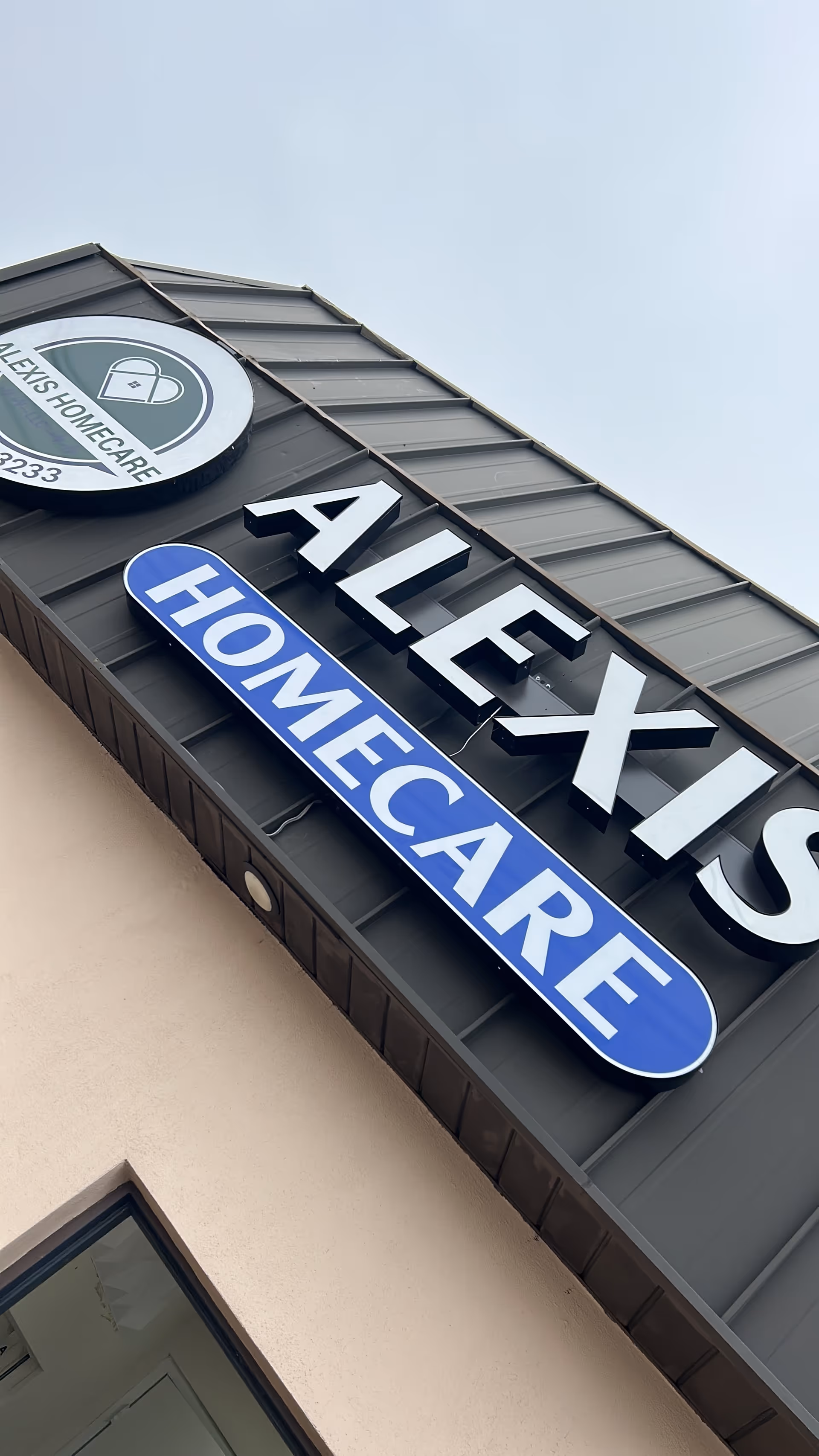 Exterior view of Alexis Homecare sign on the building facade.