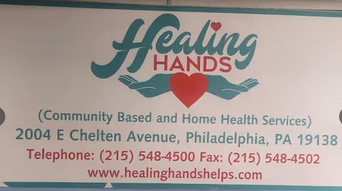 Signboard with Healing Hands logo and contact details for a home health service.
