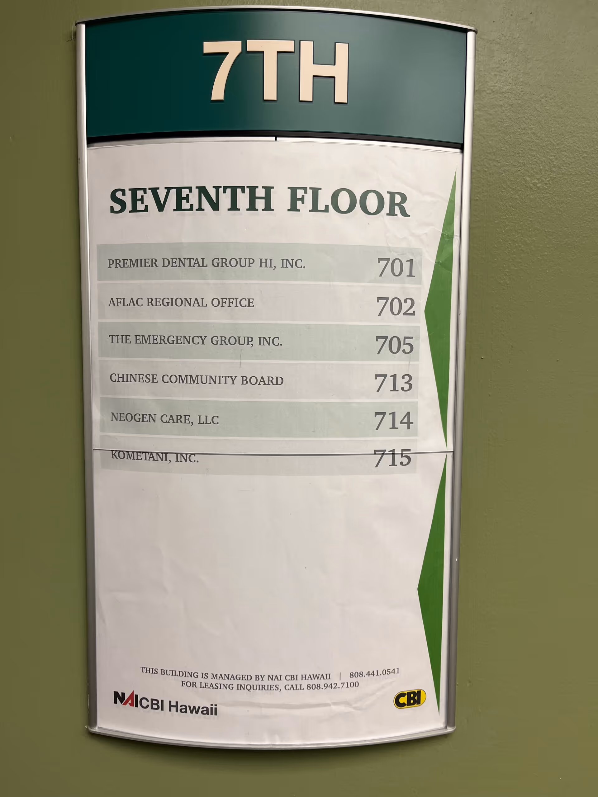 Directory sign on green wall listing the seventh floor tenants, including Neogen Care.