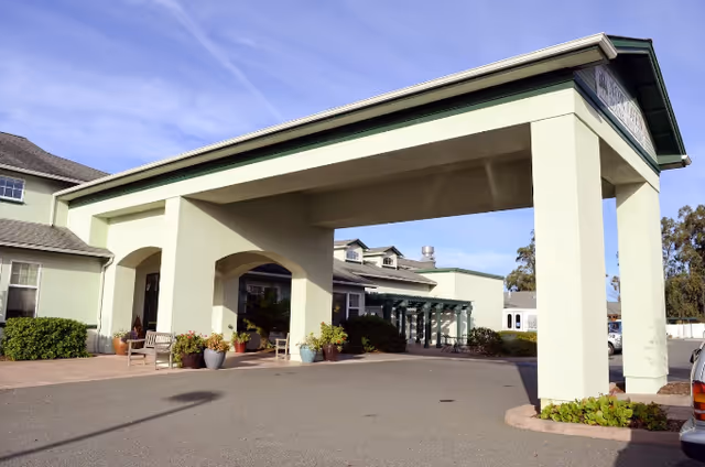 Exterior view of Timber Ridge at McKinleyville with a covered entrance and driveway.