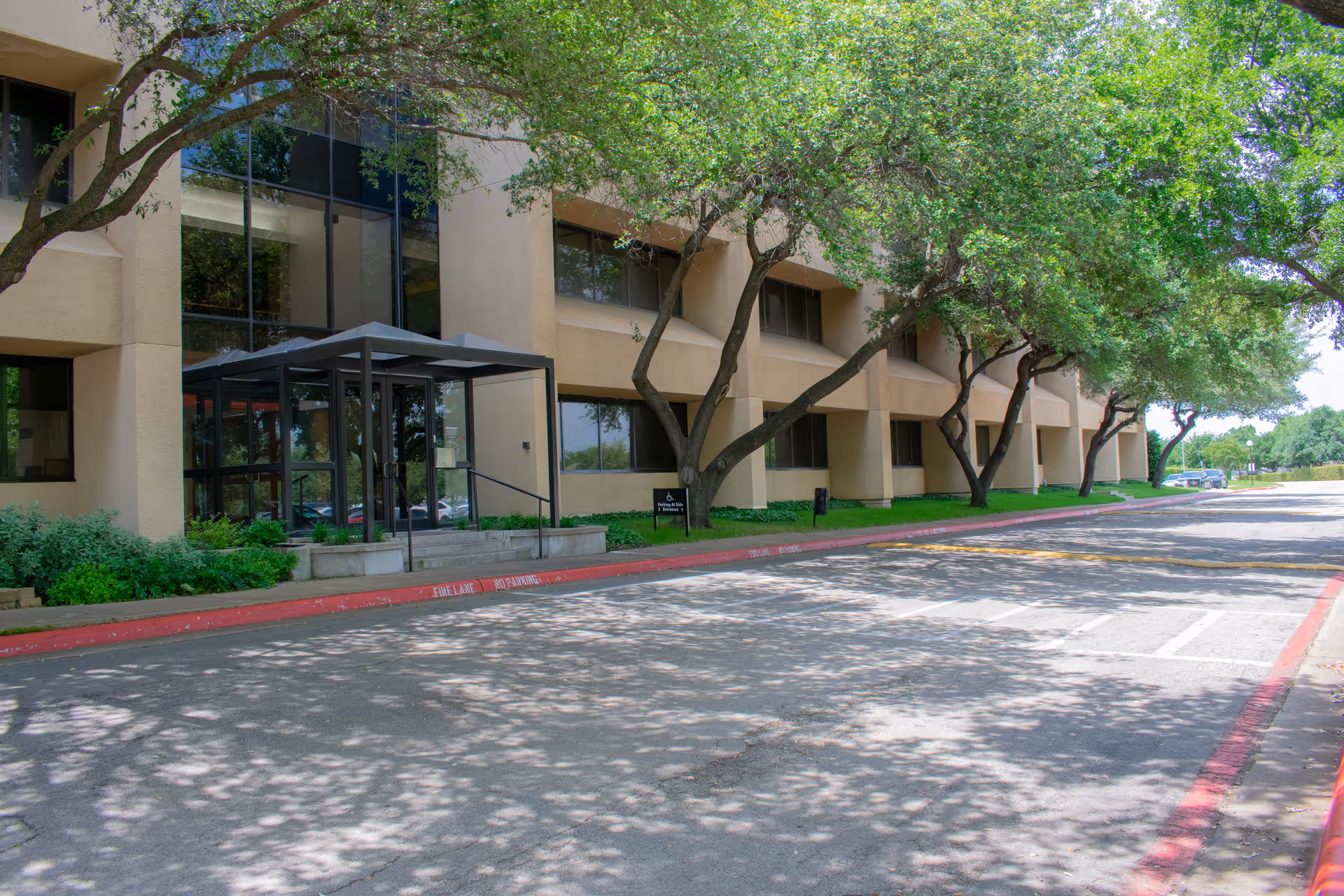 Z-2-H Family Med and Urgent Care Clinic exterior front with trees.