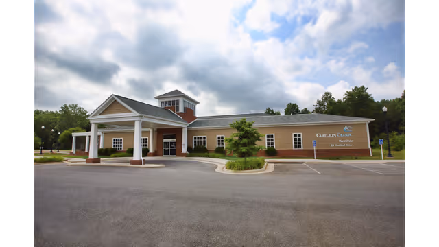 Exterior view of Carilion Clinic Home Care Bedford building with entrance and parking.