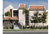 Woodbridge Manor senior living building with red-tiled roof and glass entrance.