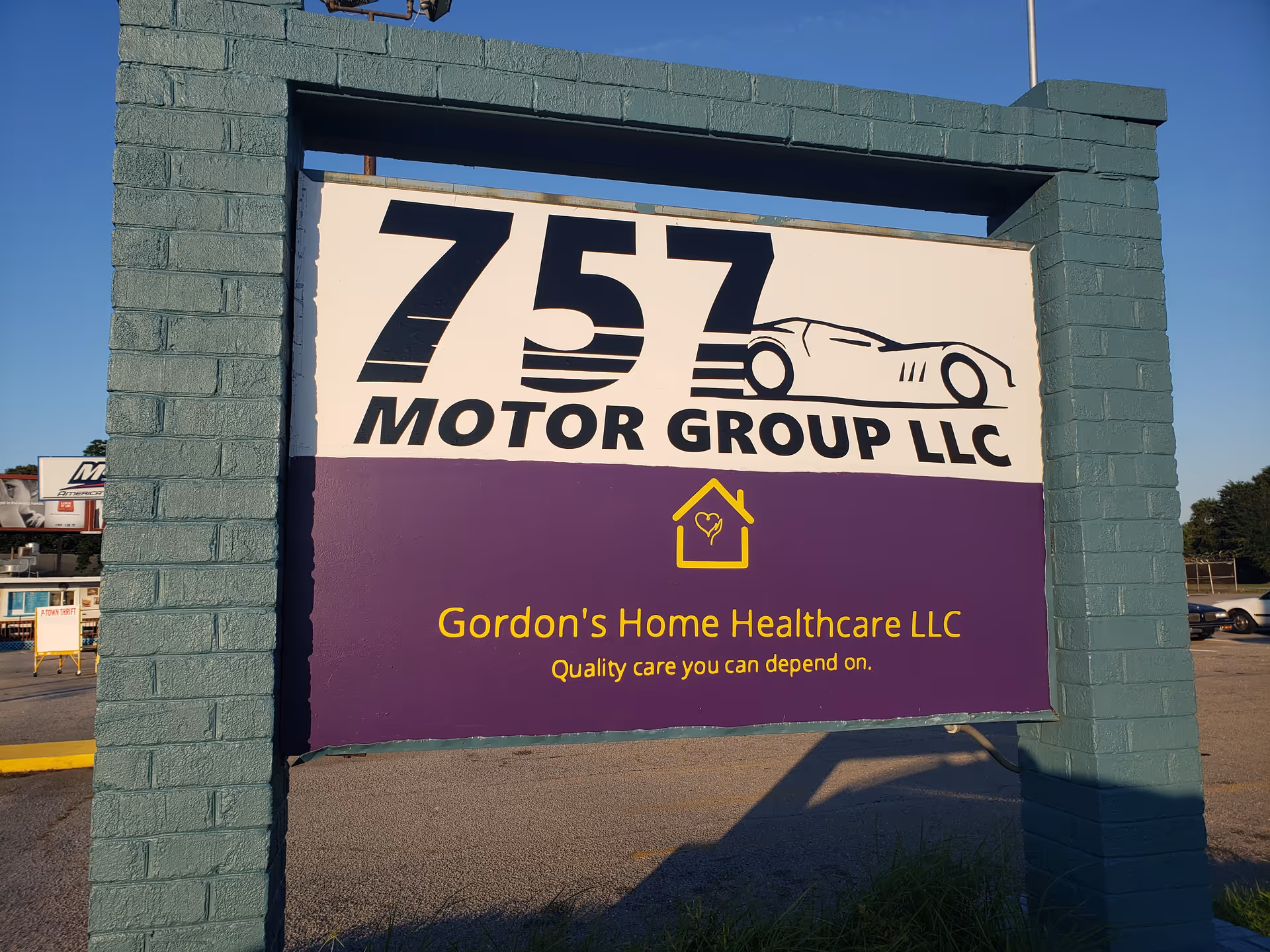 Large outdoor sign displays 757 Motor Group LLC logo and Gordon's Home Healthcare LLC text.